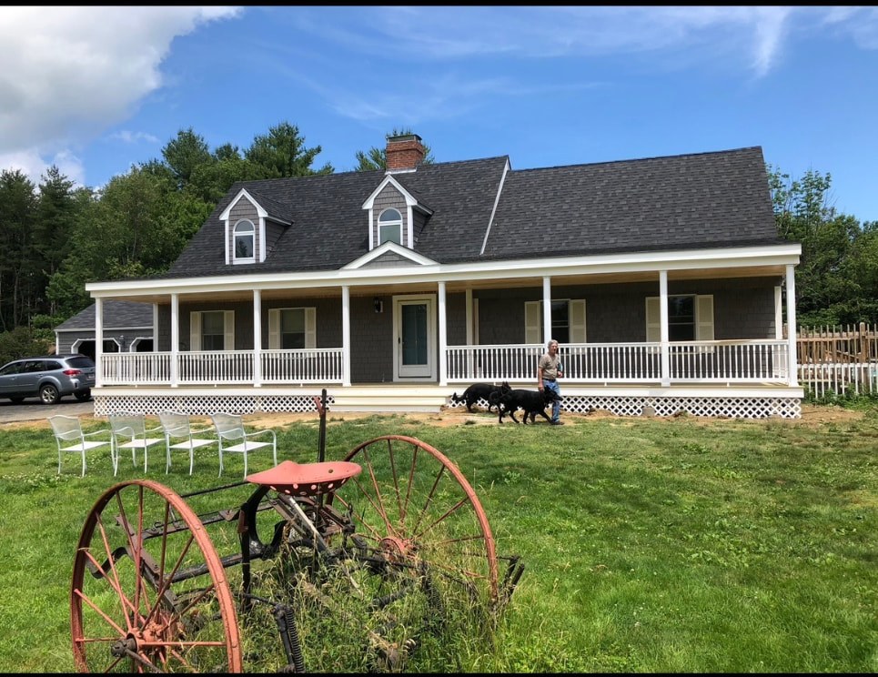 New Hampshire farmhouse with full length covered farmers porch