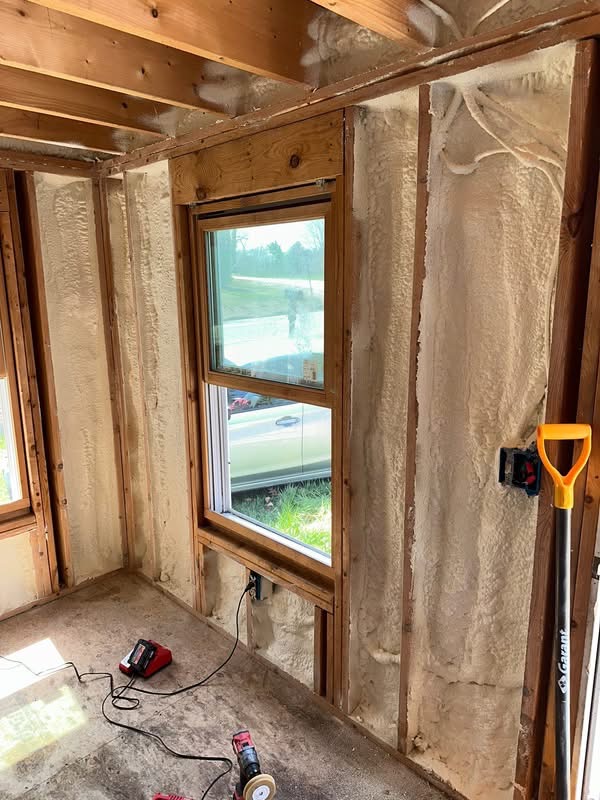 Spray foam insulation around a window opening