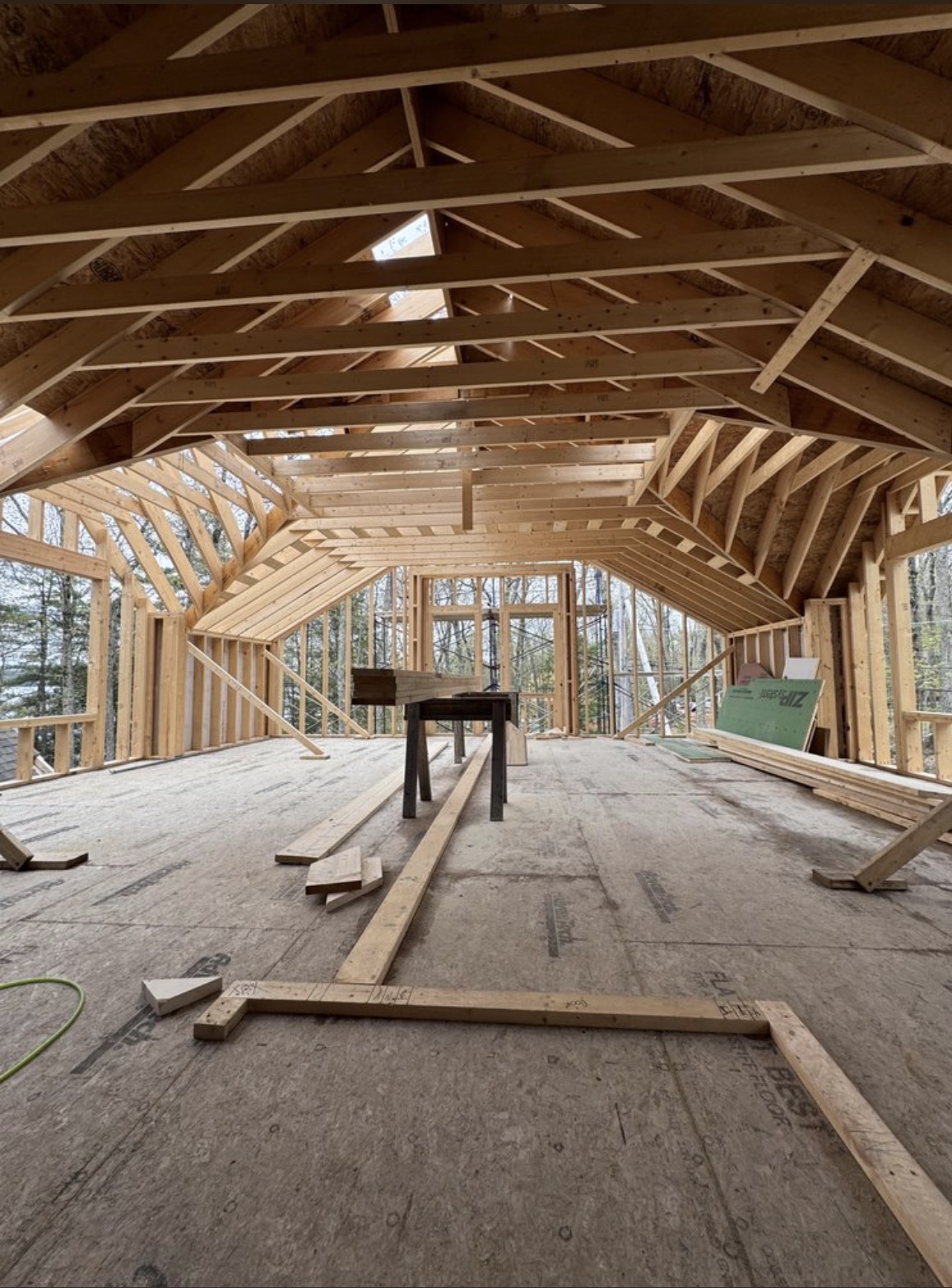 Carpenter installing custom trim inside a New Hampshire home
