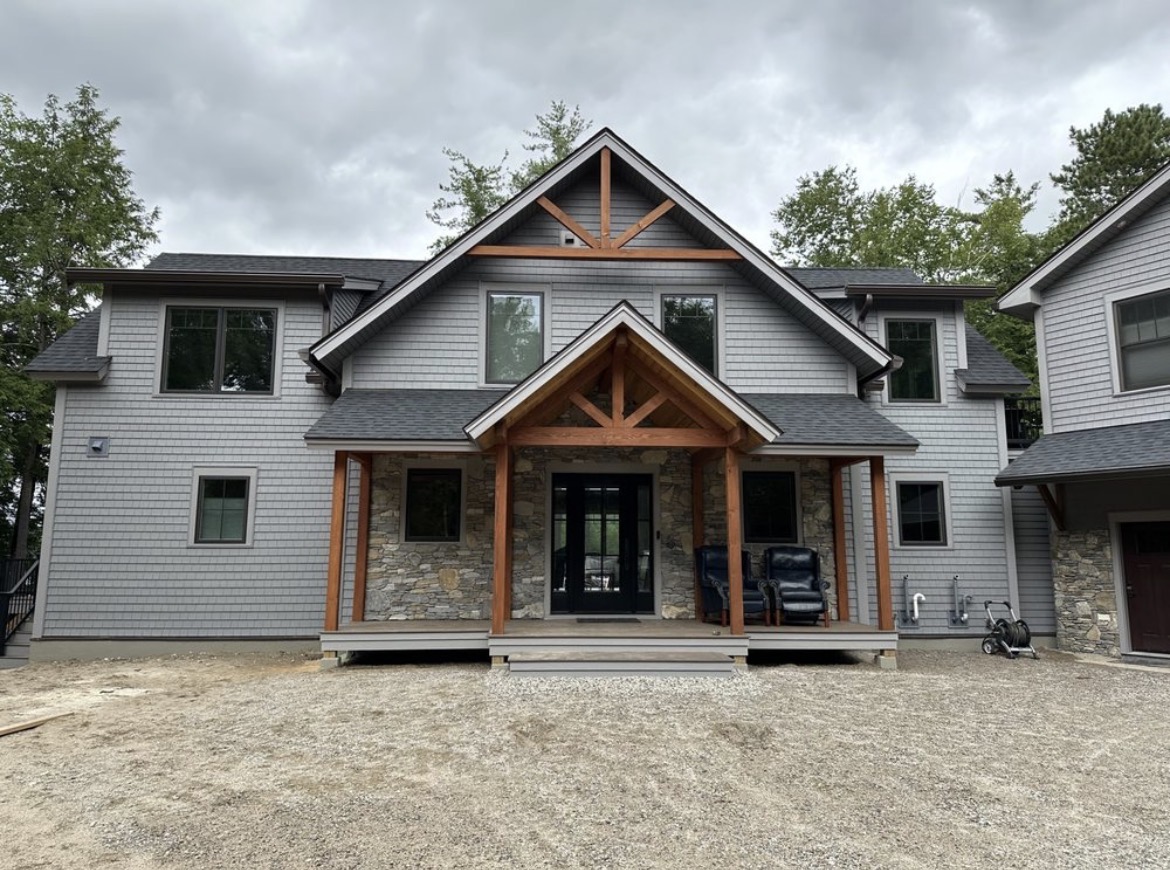 Custom fine home built in Wakefield, New Hampshire at dusk