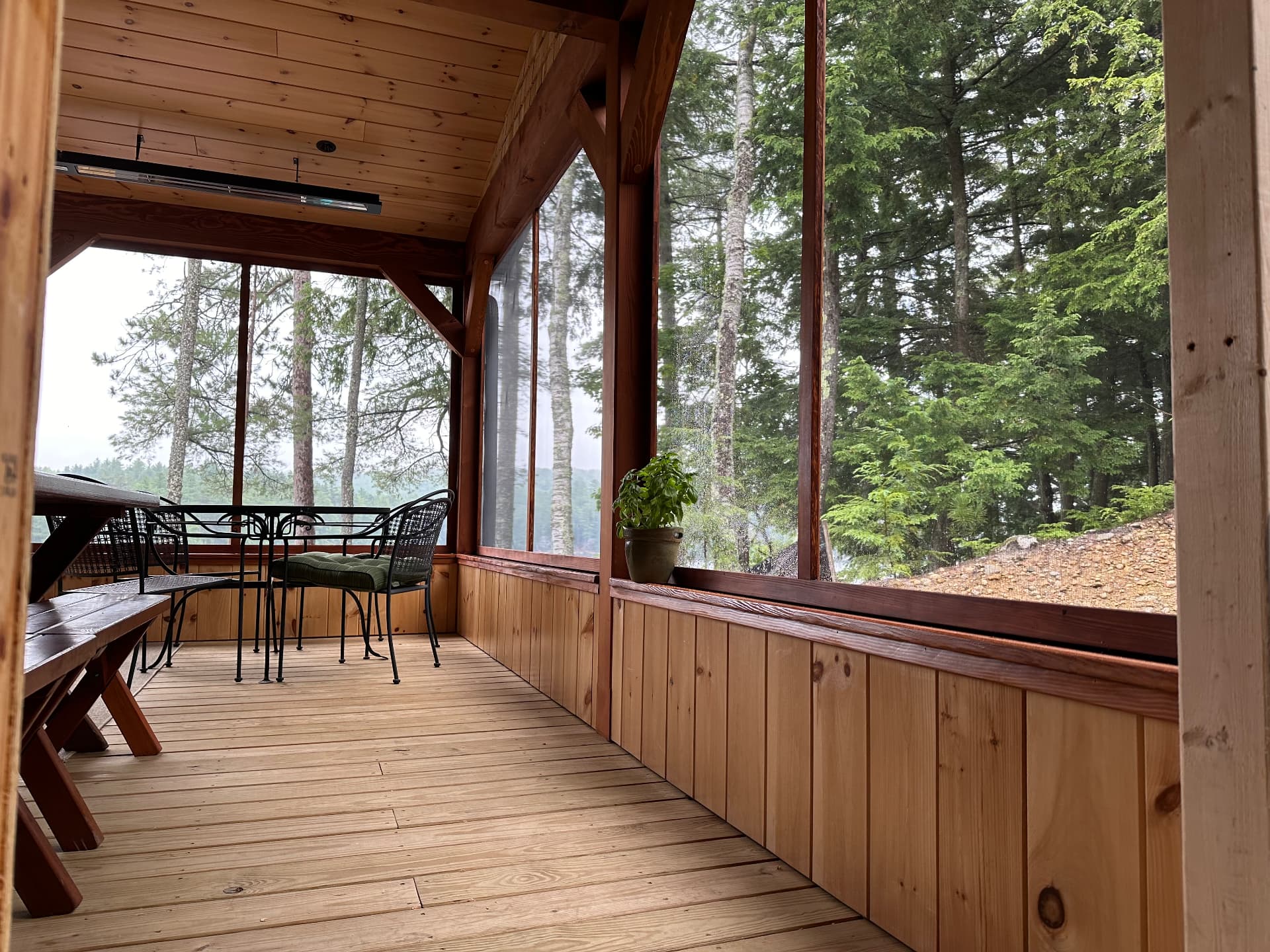 Screened porch with cedar paneling and lake views